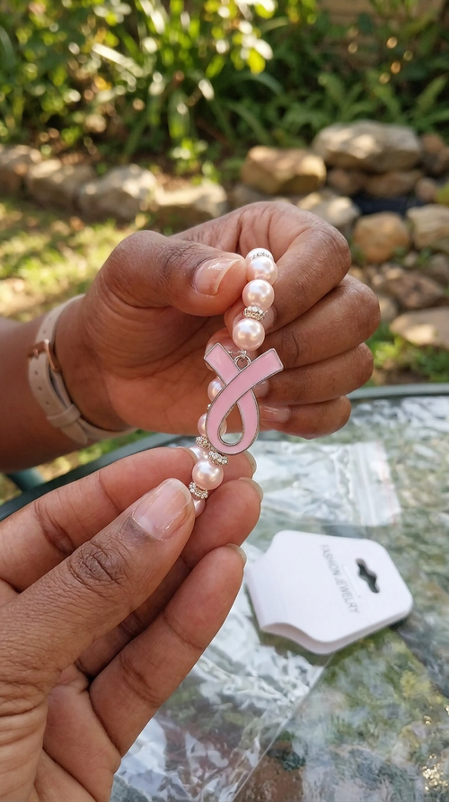 Breast Cancer lighter pink beaded bracelet w/ the Breast Cancer Awareness Ribbon